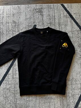 Moose Knuckles Black Crewneck Sweater with Yellow Sleeve Patch